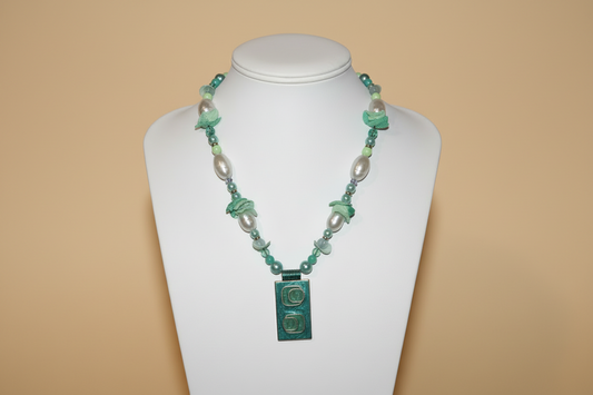 Vintage carved jade and gold pendant
